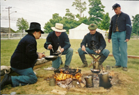 Fixing a meal over the open fire