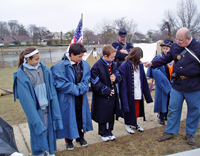 Volunteers trying out the uniforms