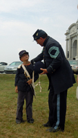 suits up a young volunteer