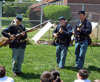 the Sergeant pulls out a cap