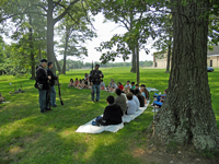 Teaching under the shade of the trees