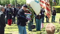 placing an offering on the grave