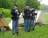 Pouring gunpowder down the muzzle