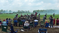 An artillery piece is moved into position