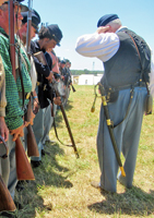 The Lieutenant inspecting weapons