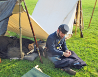 mending his uniform