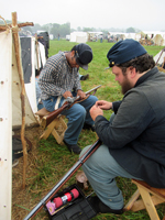 Dutifully cleaning the muskets