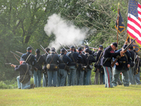 Bill helping with a misfired musket